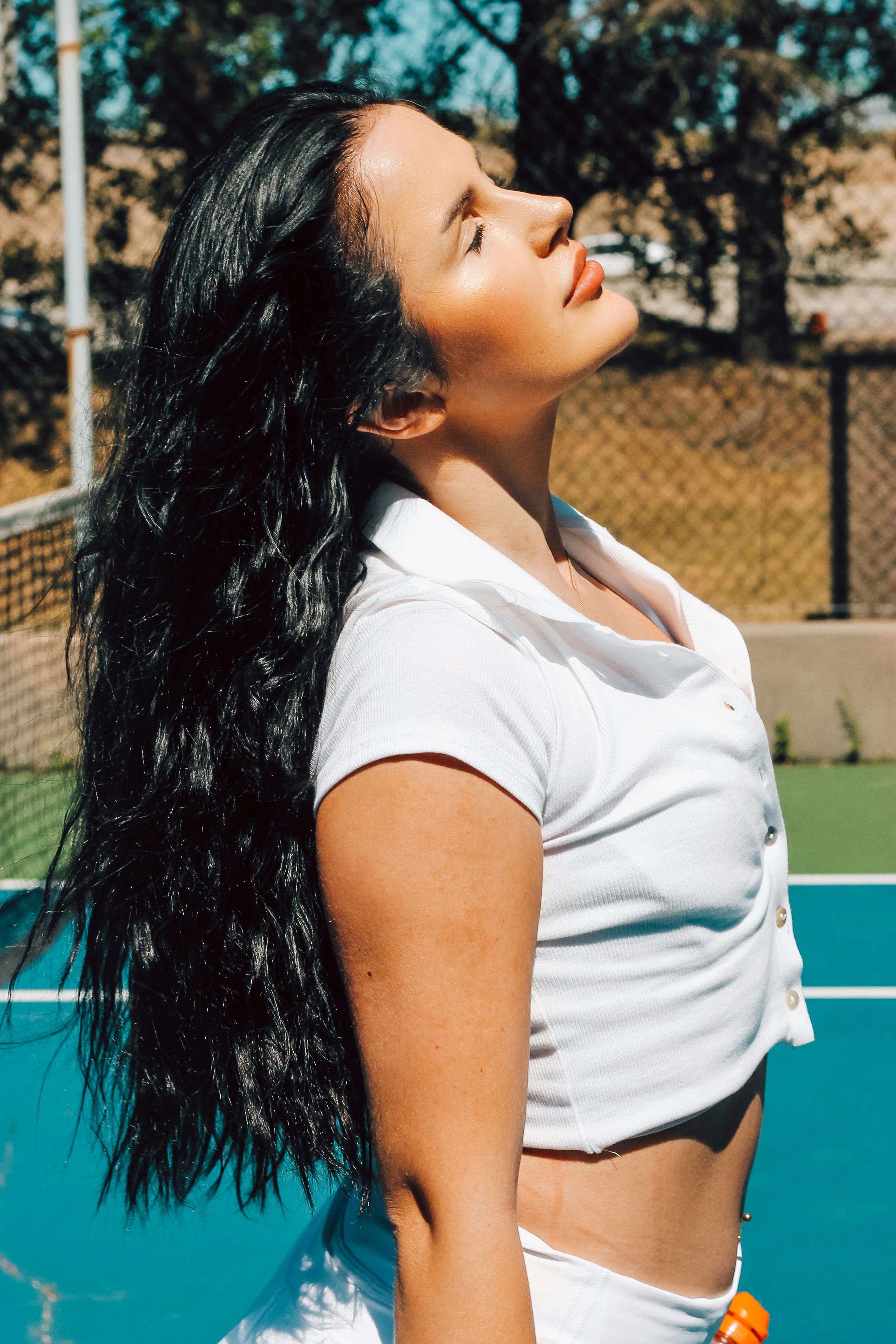 woman in white polo shirt